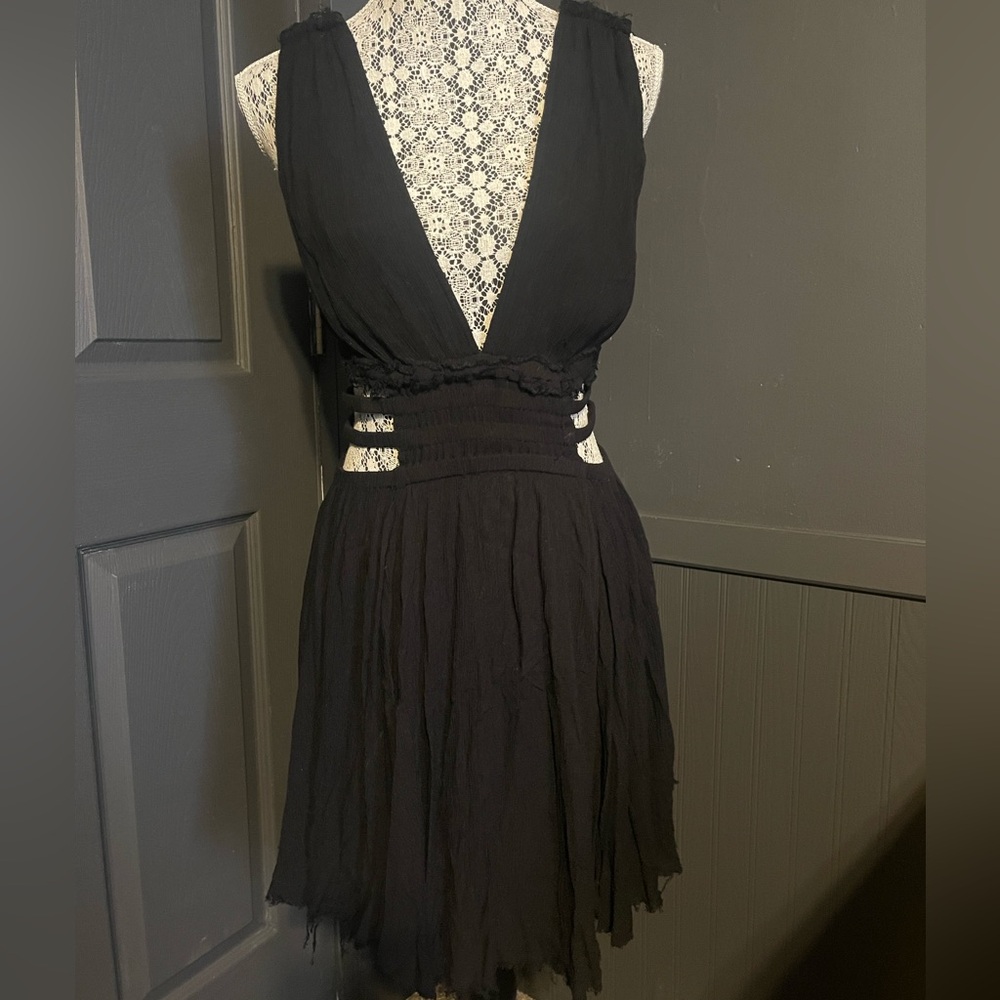 Free people cut out dress. I think it’s a small